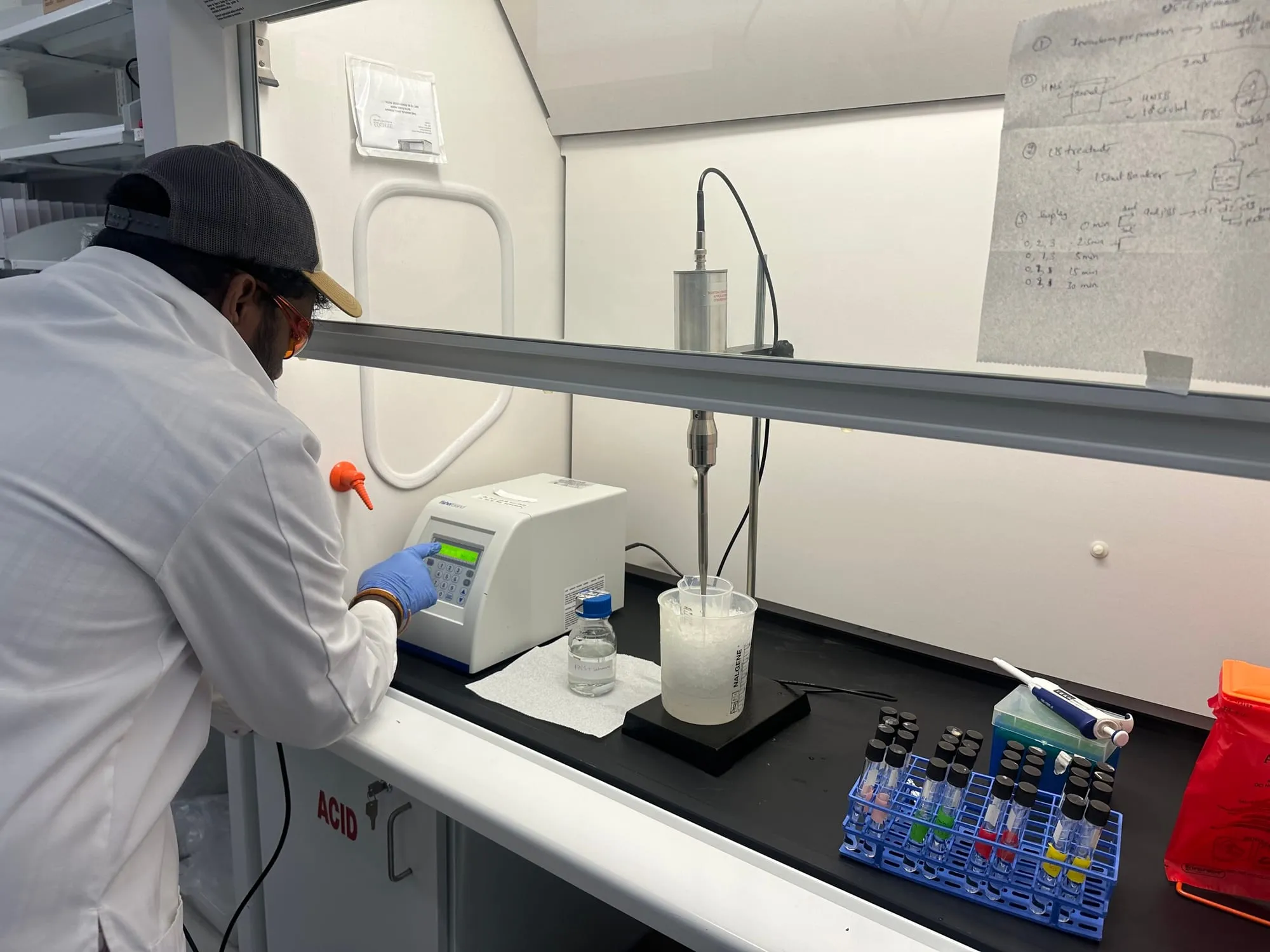 Researcher working with laboratory instruments