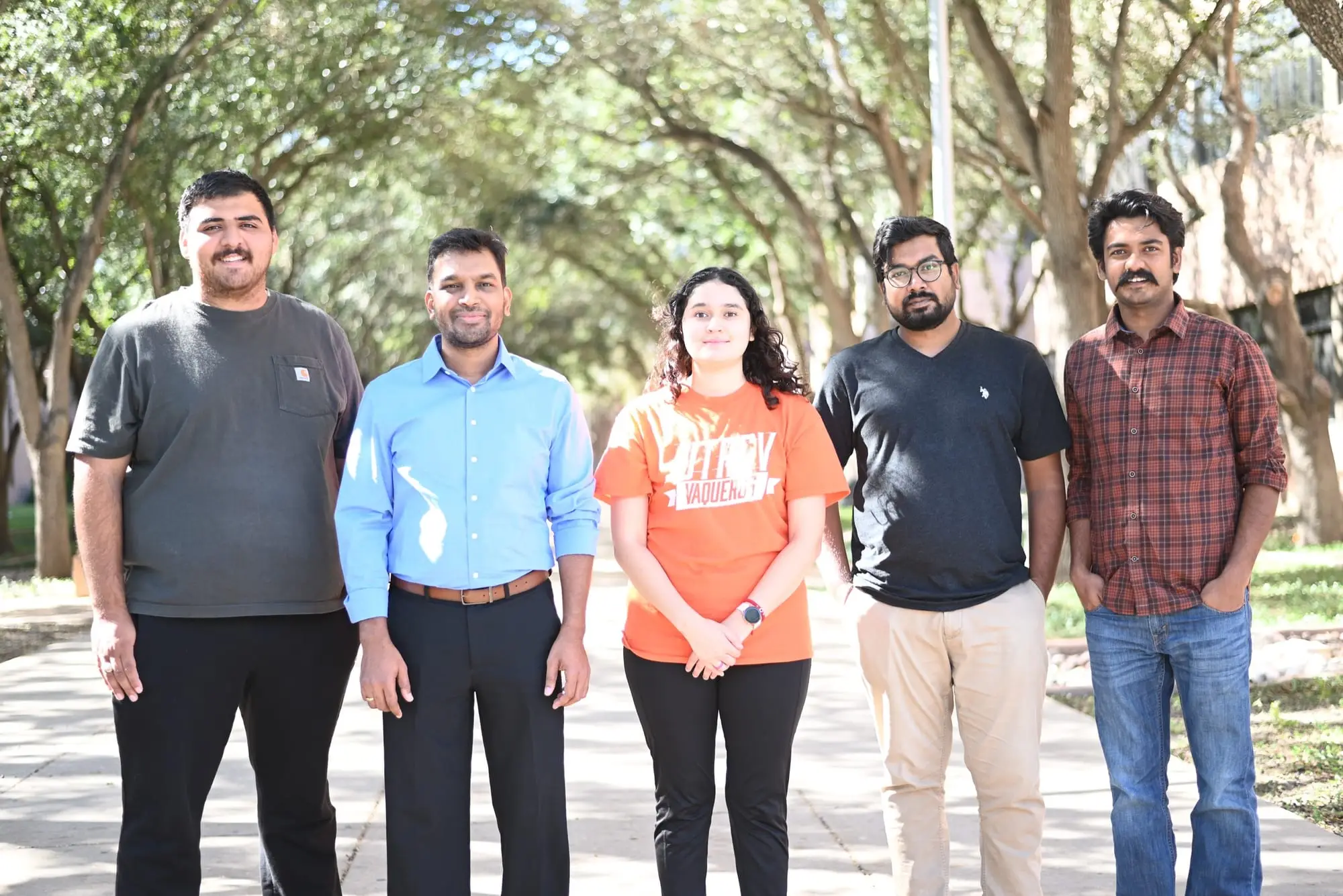 Members of the Yemmireddy Lab standing together on the UTRGV campus