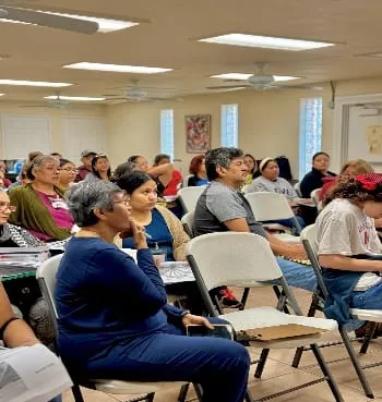 Community members seated during a training event